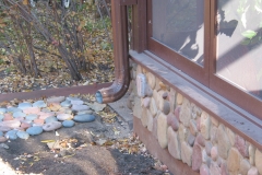 Stone wall of porch built by Whole Builders